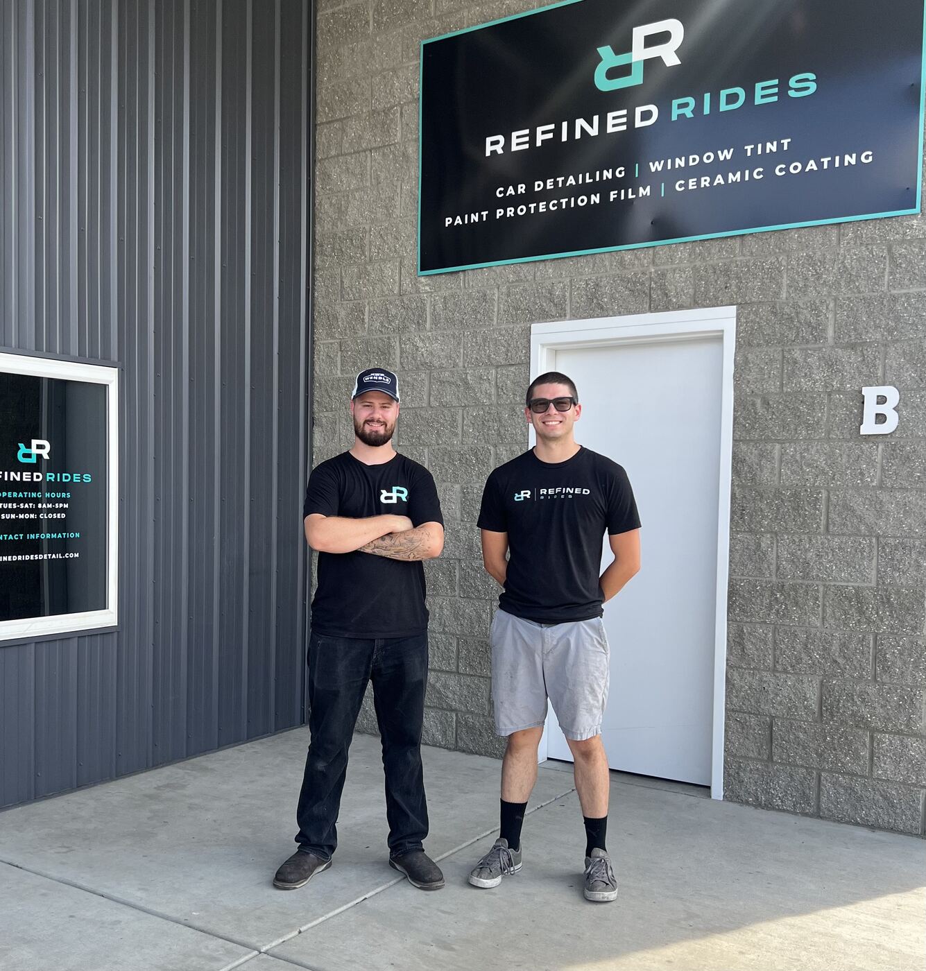 Eric and Caleb in front of the Refined Rides shop
